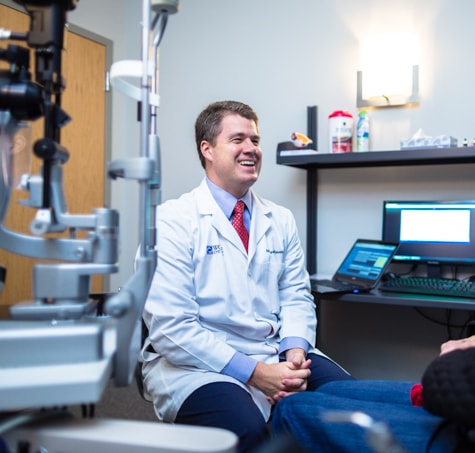 Dr. Matthew Rauen, Wolfe Eye Clinic LASIK surgeon, meets with LASIK patient to discuss vision and LASIK candidacy.